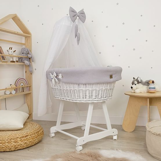 White wicker bed with equipment for a baby - Hedgehog